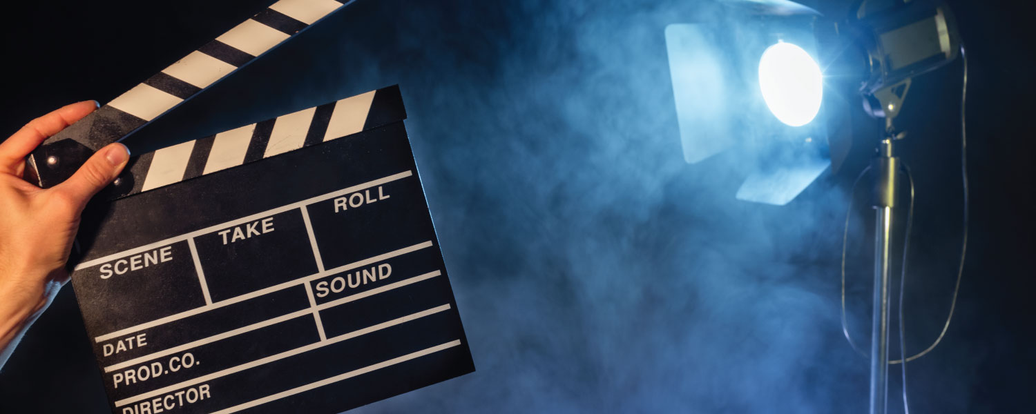 Movie clapperboard with spotlight