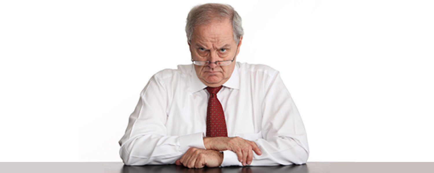 Unhappy man in business clothes staring at you