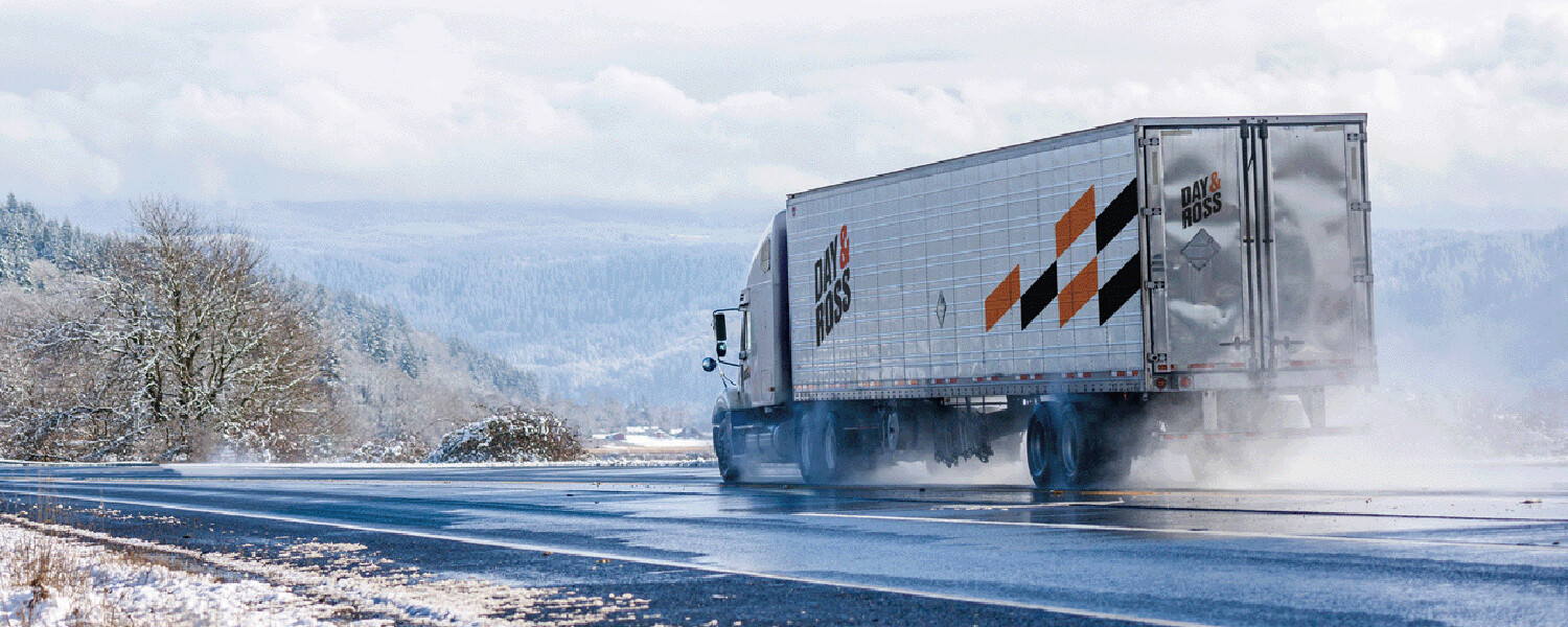 Day and Ross truck driving on wet road