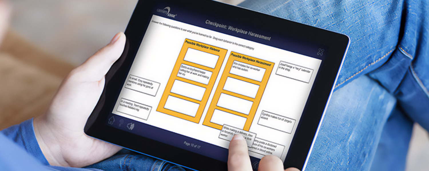 Person completing Harassment and violence course on a tablet