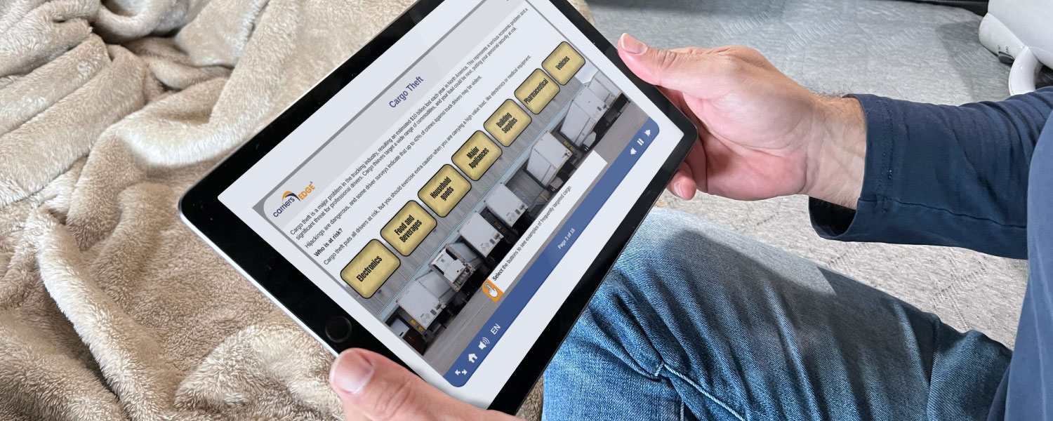 Man completing course on a tablet inside of truck cab